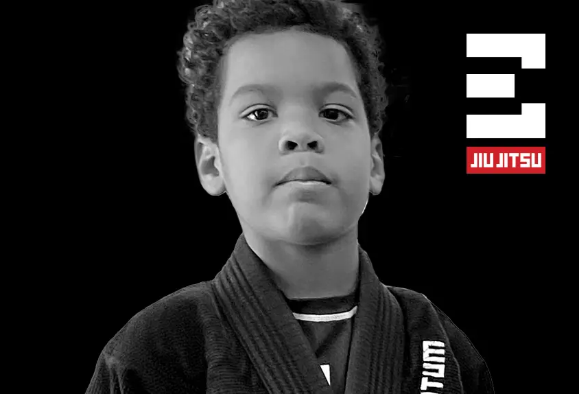 Young student in a gi representing the Kids 3 Jiu-Jitsu program at Elementum